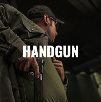 person pulling handgun from side holster